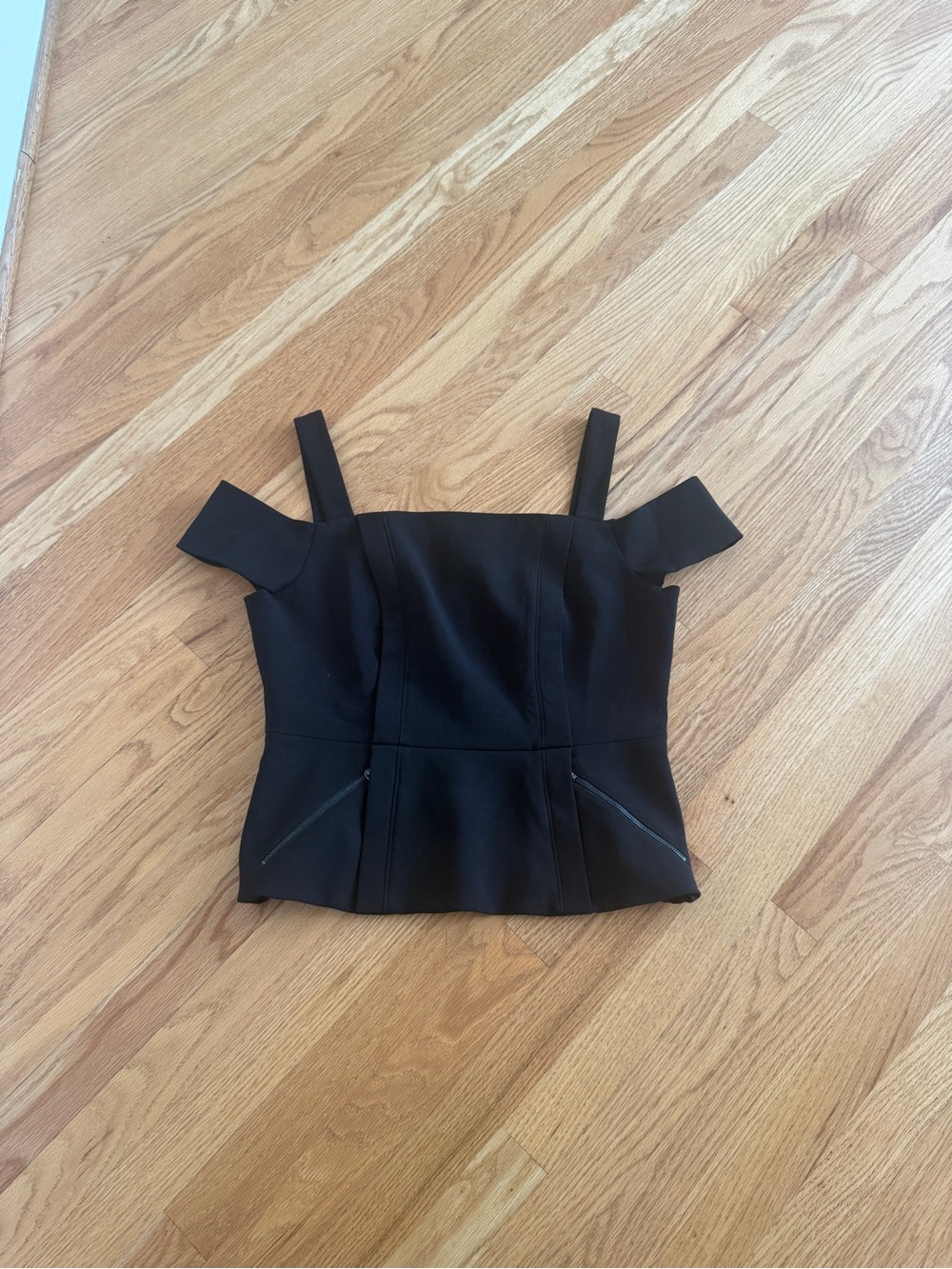 BCBGMaxazria black off shoulder and tank styled peplum blouse